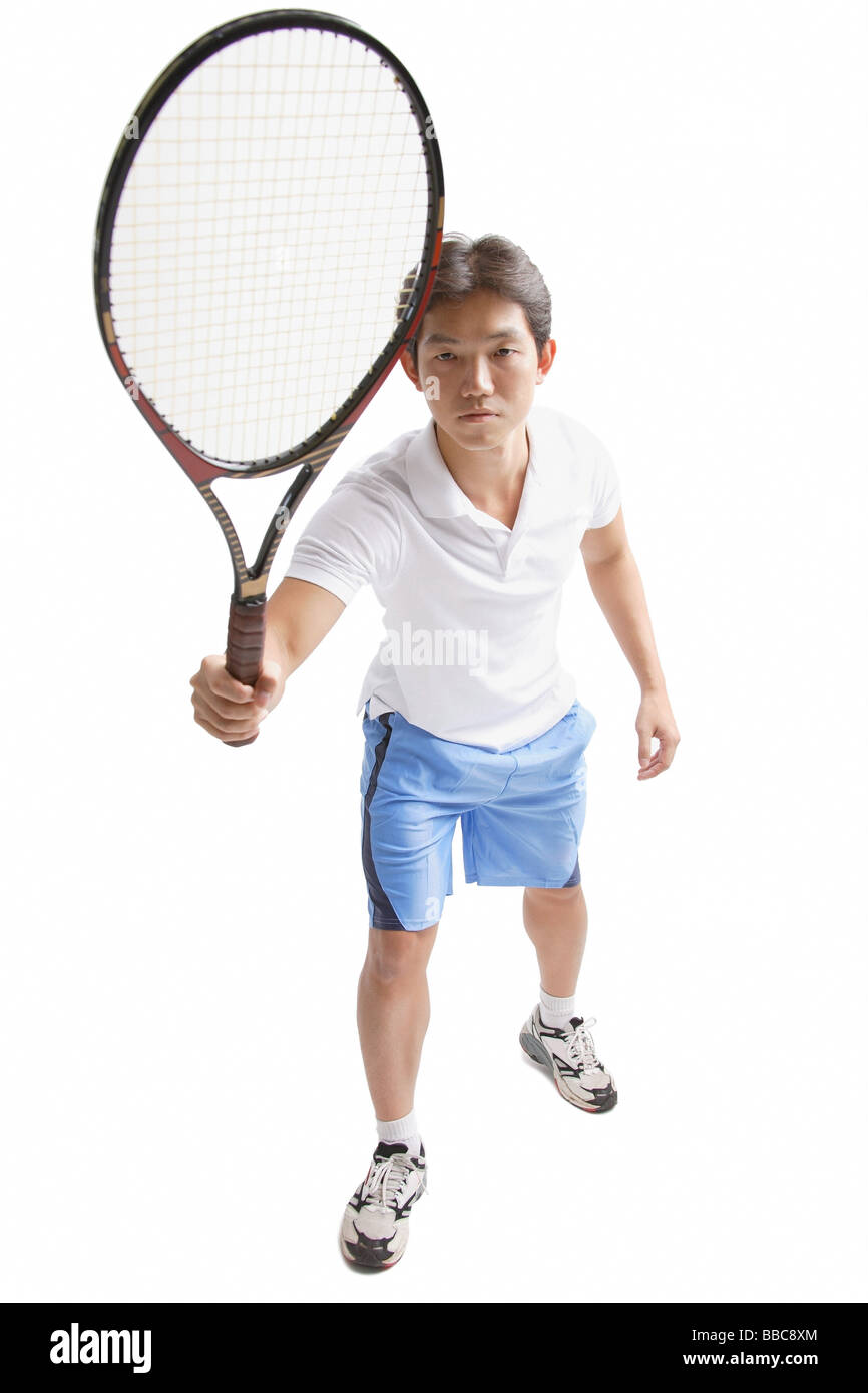 Young man holding tennis racket Stock Photo Alamy
