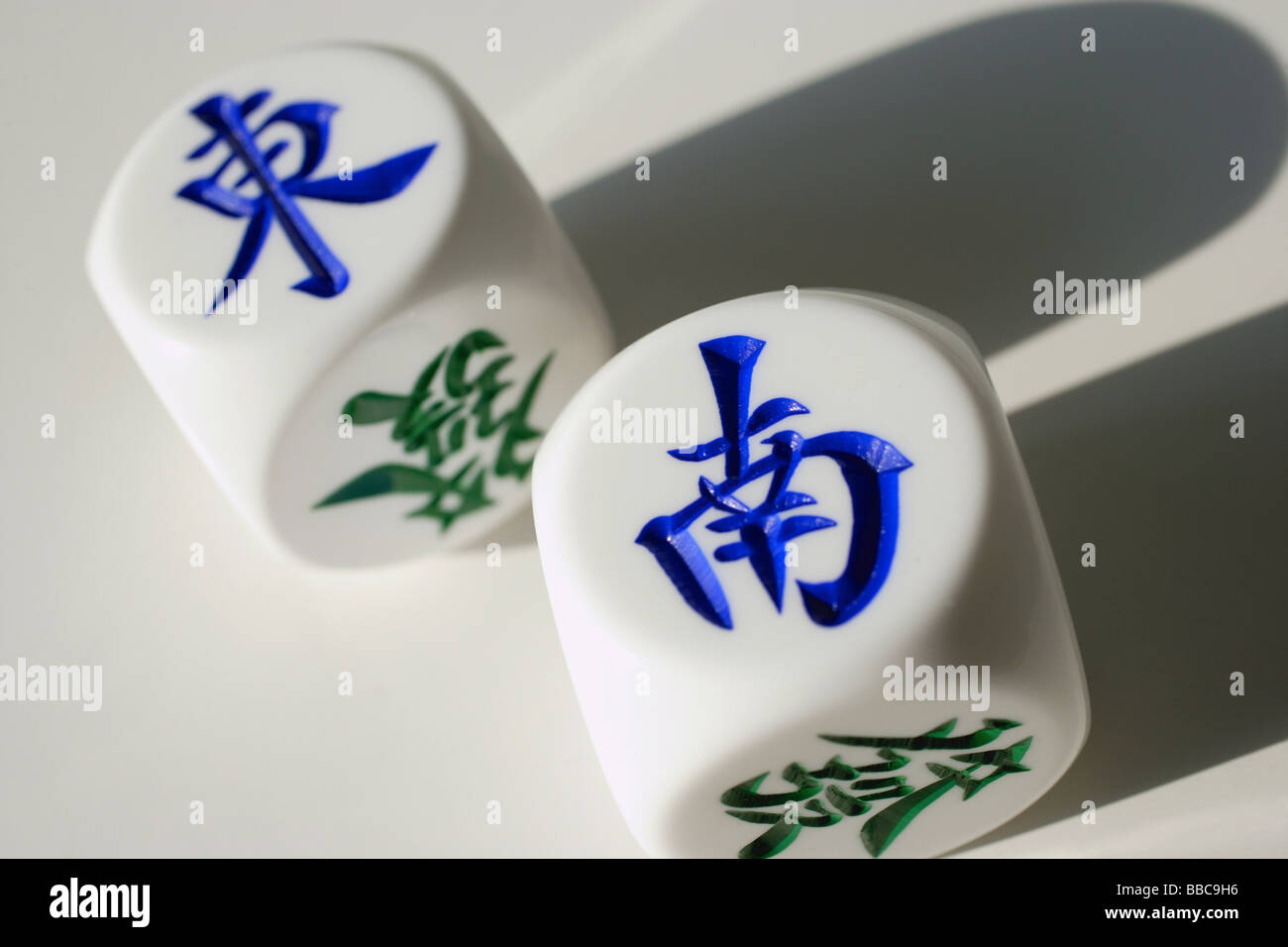 Still life of Chinese dice with the words 'East' and 'South' Stock