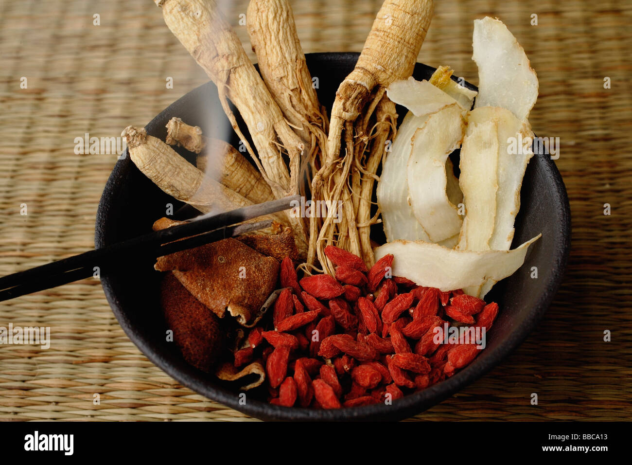 Bowl filled with Chinese medicinal herbs Stock Photo