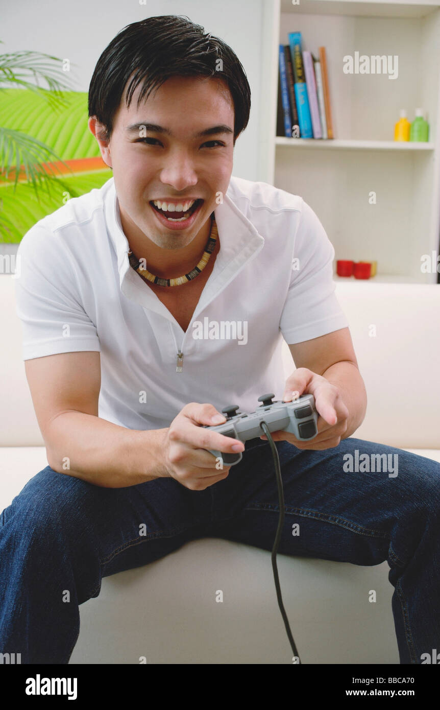 Man holding video game controller Stock Photo Alamy