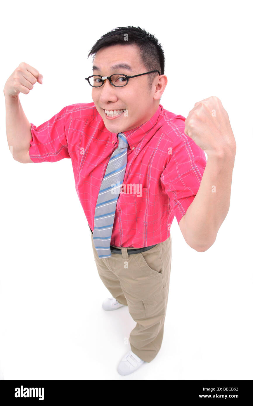 Man flexing his arms, smiling at camera Stock Photo Alamy