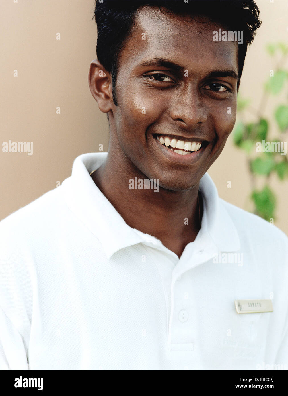 Maldives, Kuda Huraa atoll, Four Seasons Resort, Portrait of Indian Spa attendant. Stock Photo