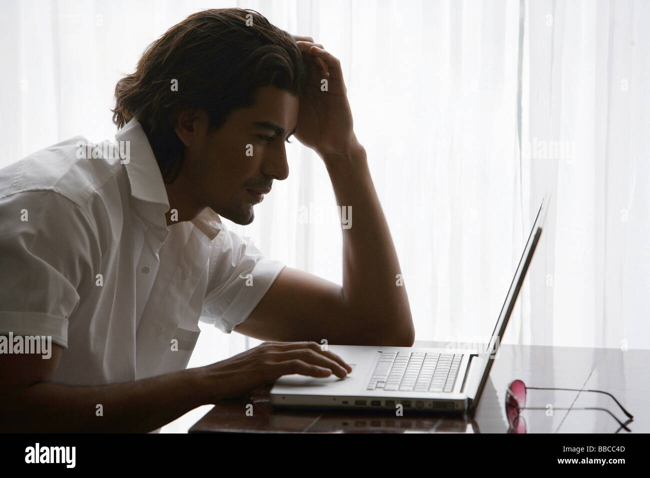 Laptop man hi-res stock photography and images - Alamy