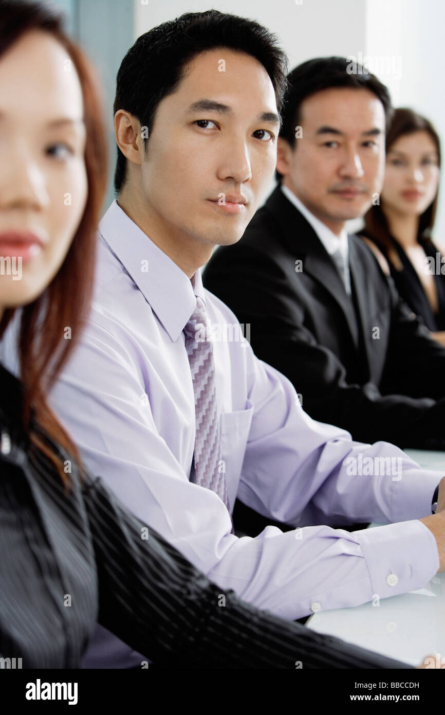 Business people sitting in a row Stock Photo - Alamy