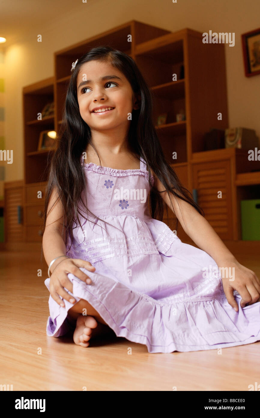 little girl in purple dress Stock Photo