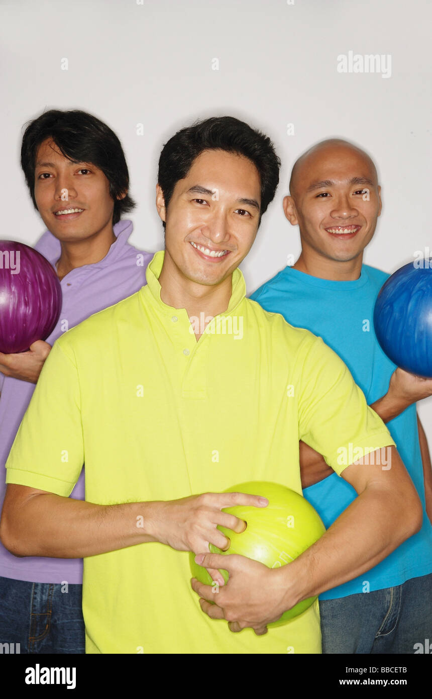 Three men holding bowling balls hires stock photography and images Alamy