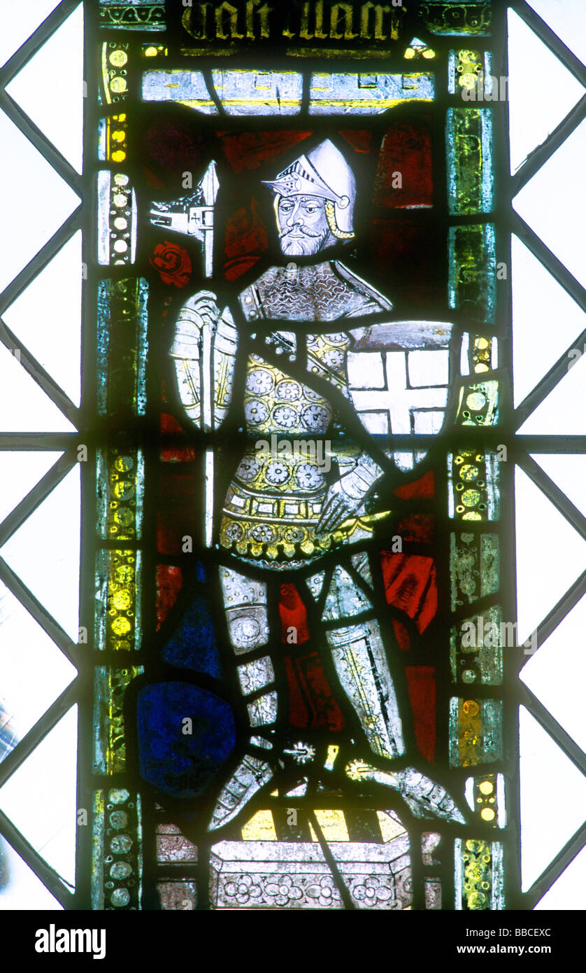 Medieval Knight in armour stained glass window Castle Acre Norfolk East Anglia England UK early 15th century Stock Photo