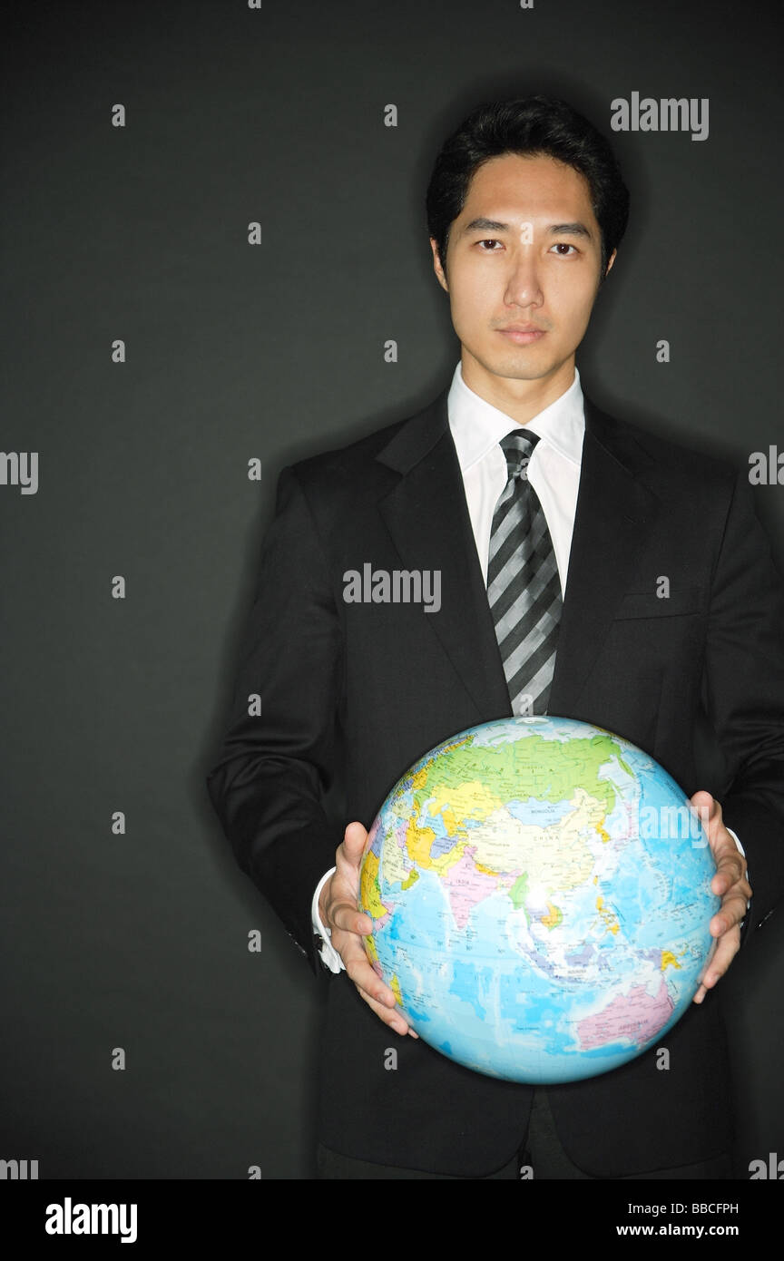 Holding globe in two hands hi-res stock photography and images - Alamy