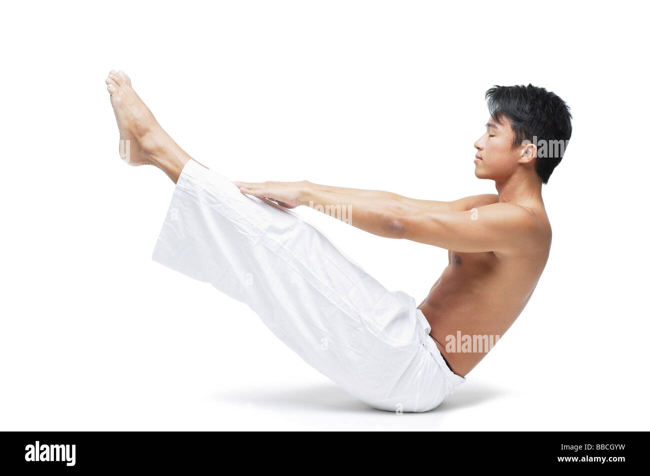 Man stretching floor legs Cut Out Stock Images & Pictures - Alamy
