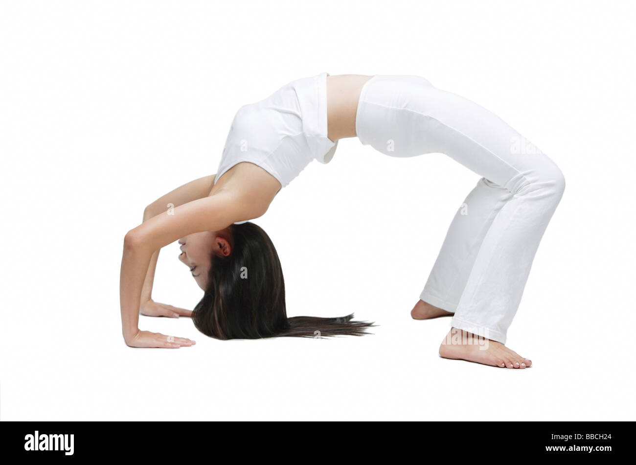 Woman doing yoga, bridge position Stock Photo