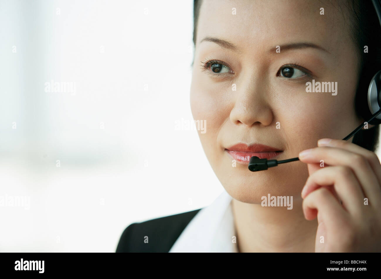 Woman adjusting hair bun hi-res stock photography and images - Alamy