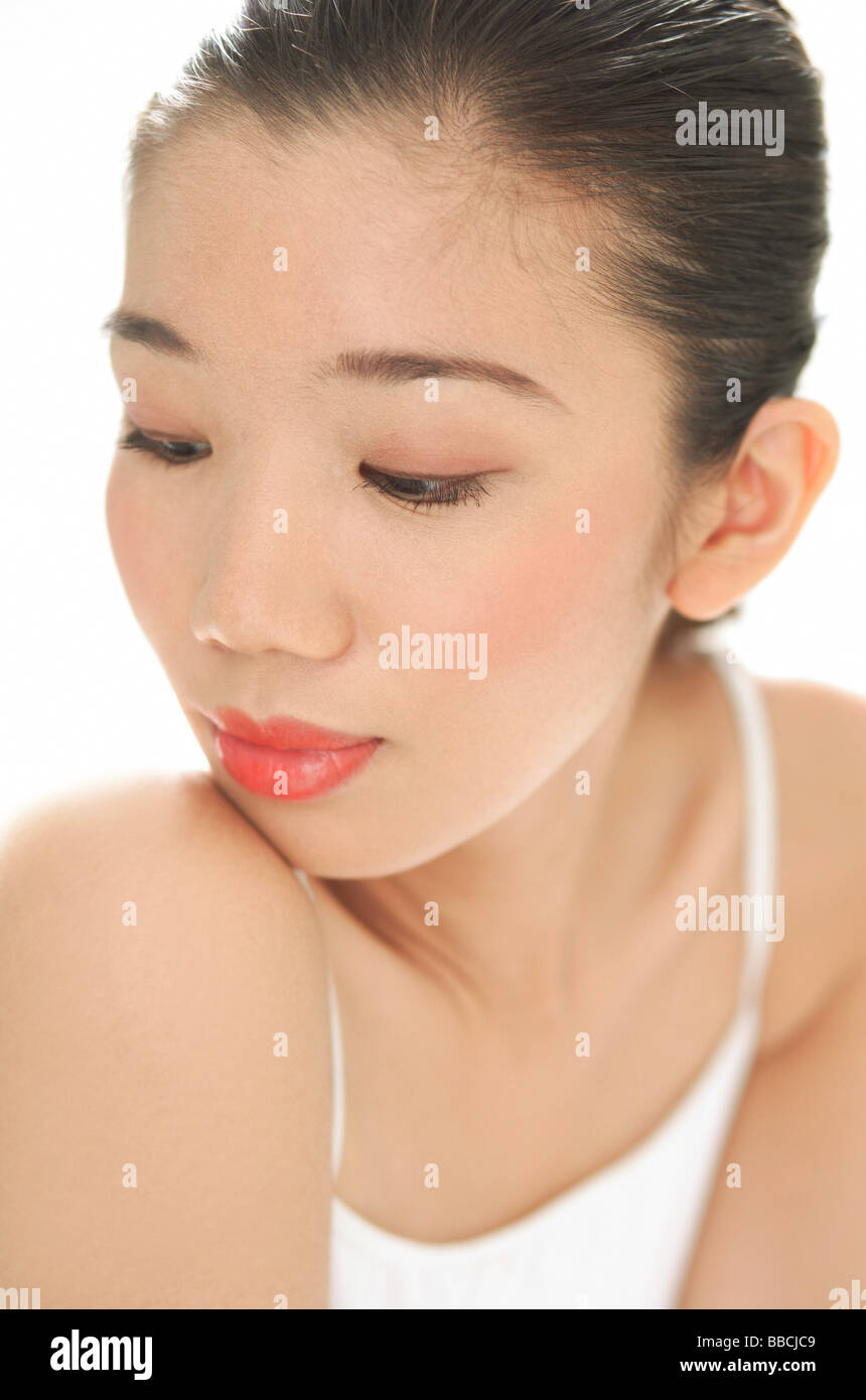 Woman with downward glance, head shot Stock Photo