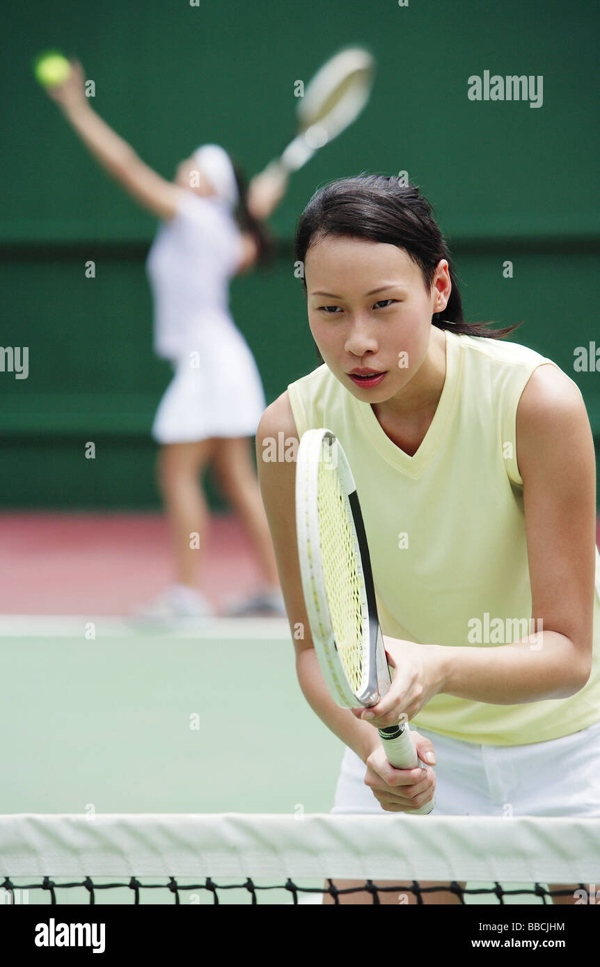 Woman holding tennis racket Stock Photo Alamy