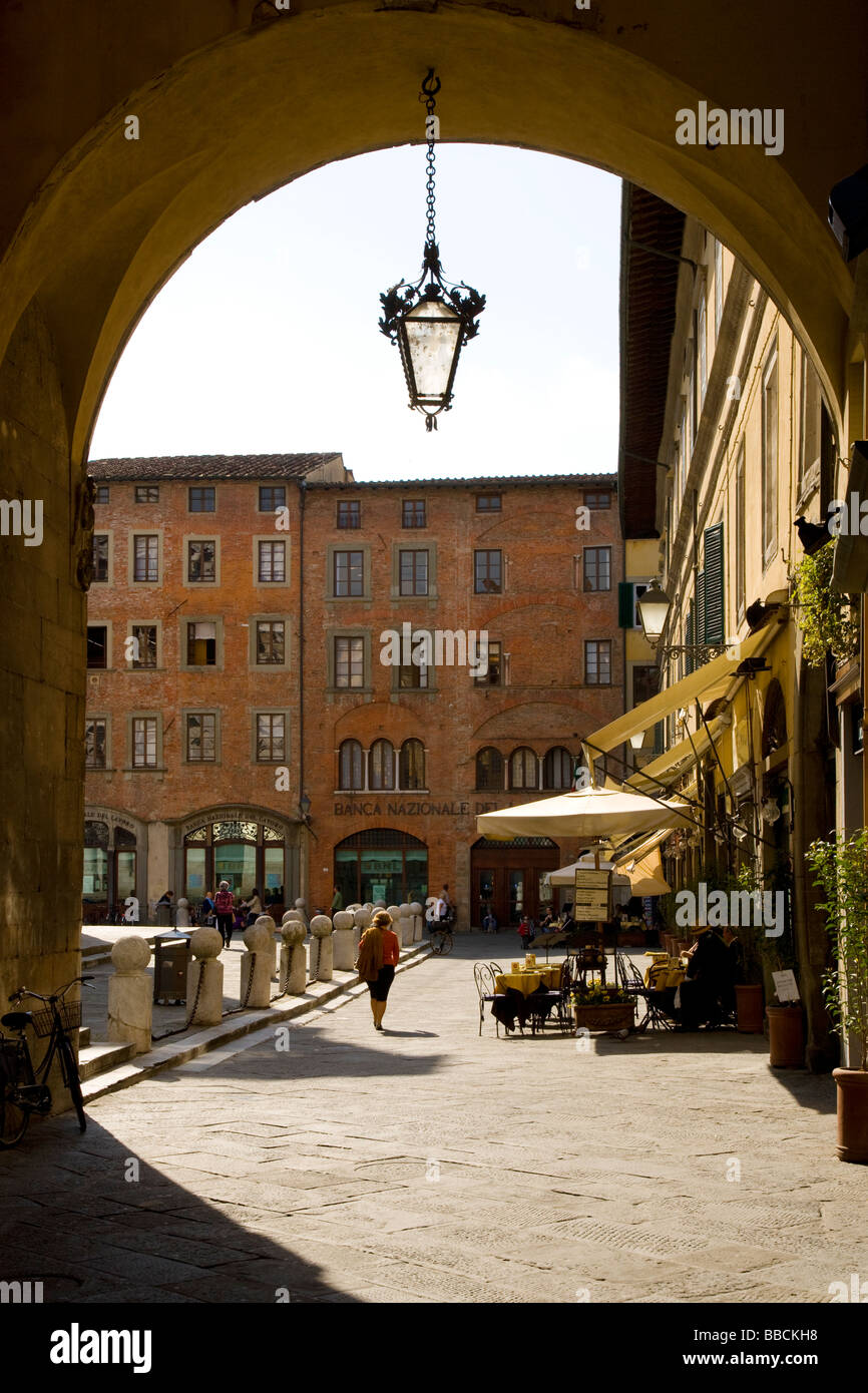 View through arch into piazza San Michele,  Lucca, Tuscany, Italy Stock Photo