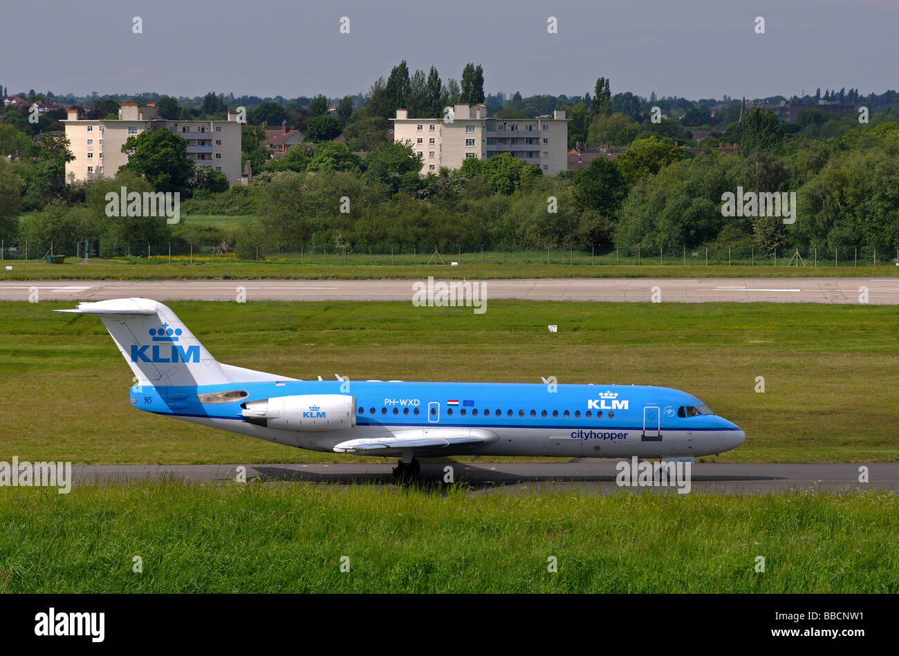 KLM Cityhopper Fokker 70 aircraft taxiing at Birmingham International Airport, UK Stock Photo