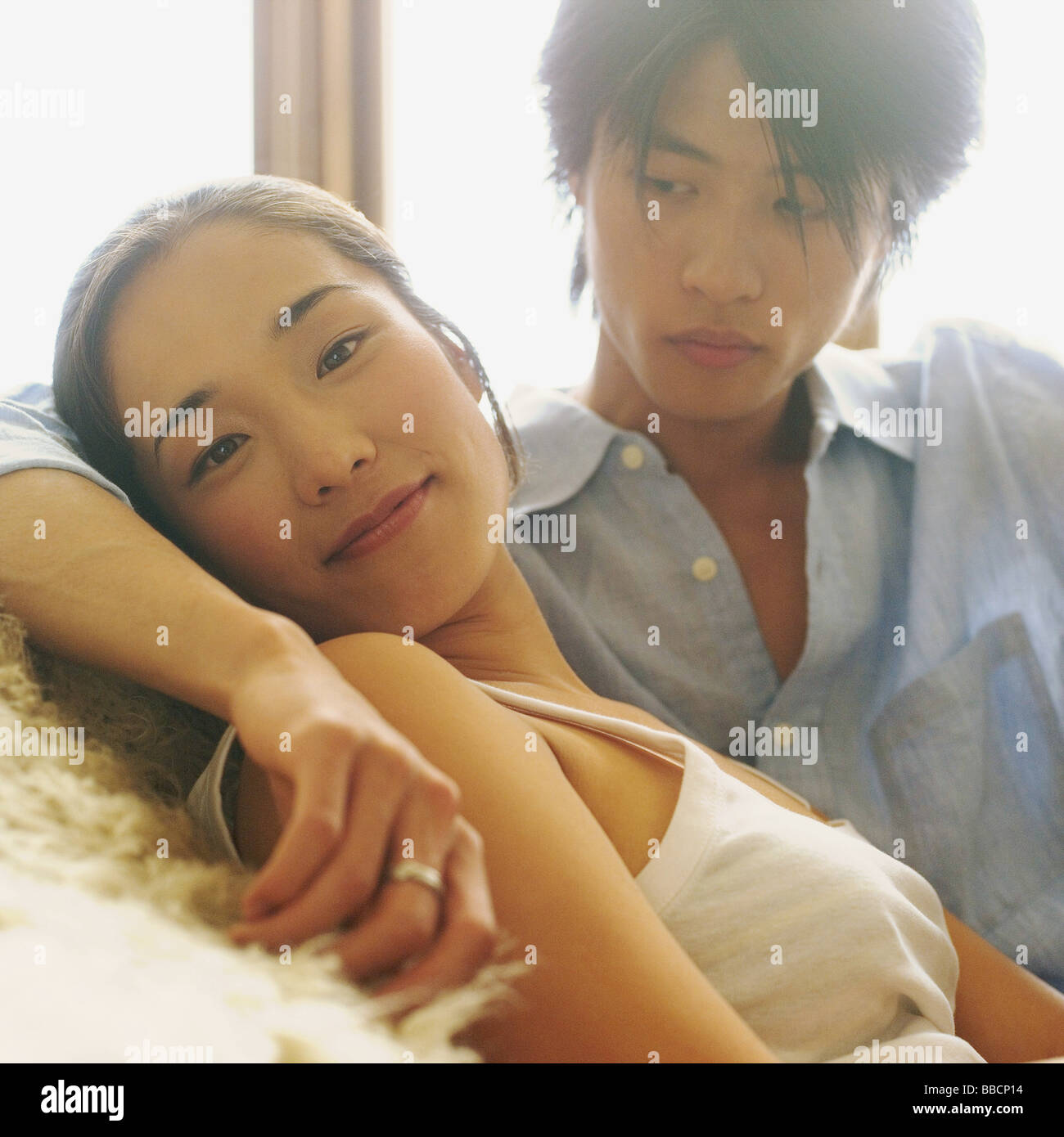 Asian couple looking man woman hi-res stock photography and images - Alamy