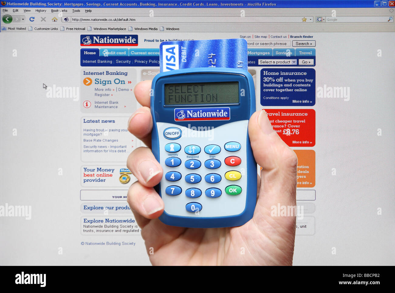 Nationwide building society chip and pin card reader held in hand, UK Stock Photo
