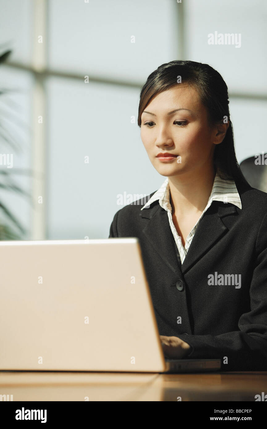 Young woman using laptop Stock Photo - Alamy