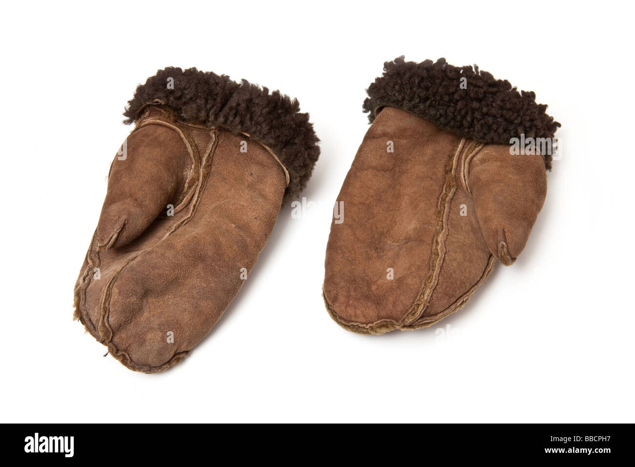 Sheepskin mittens or gloves isolated on a white studio background Stock ...
