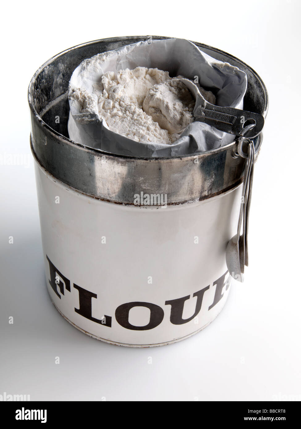 Flour in a packet inside a tin Stock Photo