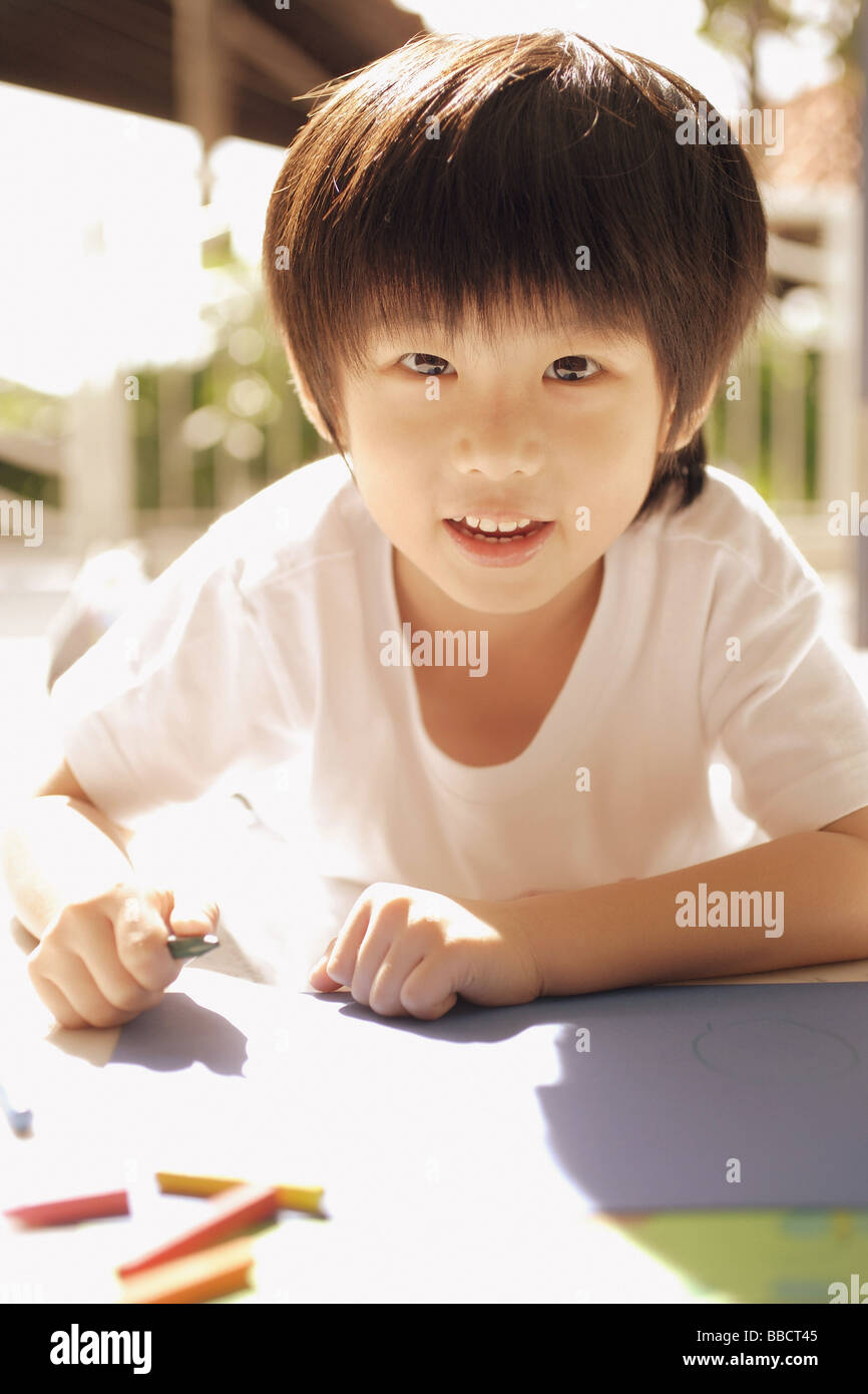 Young boy looking at camera Stock Photo - Alamy