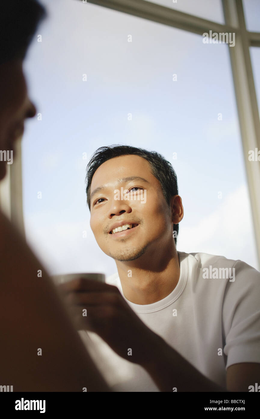 Young asian man woman talking hi-res stock photography and images - Alamy