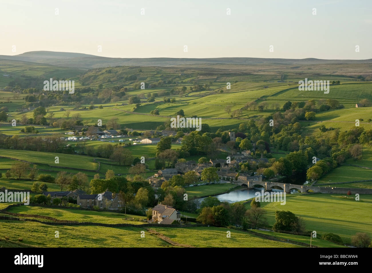 A view of the rolling valley and village of Burnsall, in Wharfedale, Yorkshire Dales, from Burnsall Fells Stock Photo