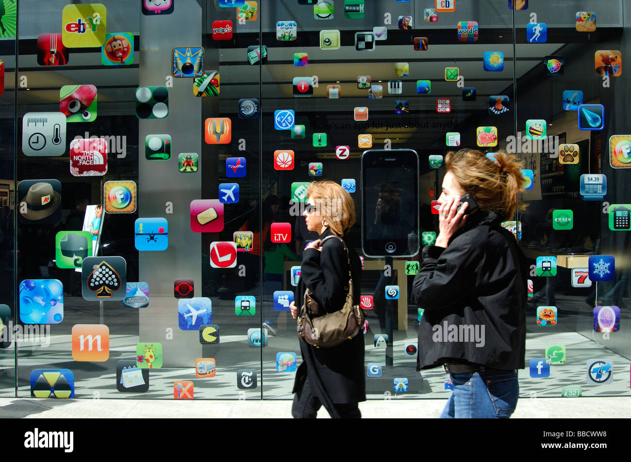 Two women outside the Apple Store Boylston Street Boston, Massachusetts