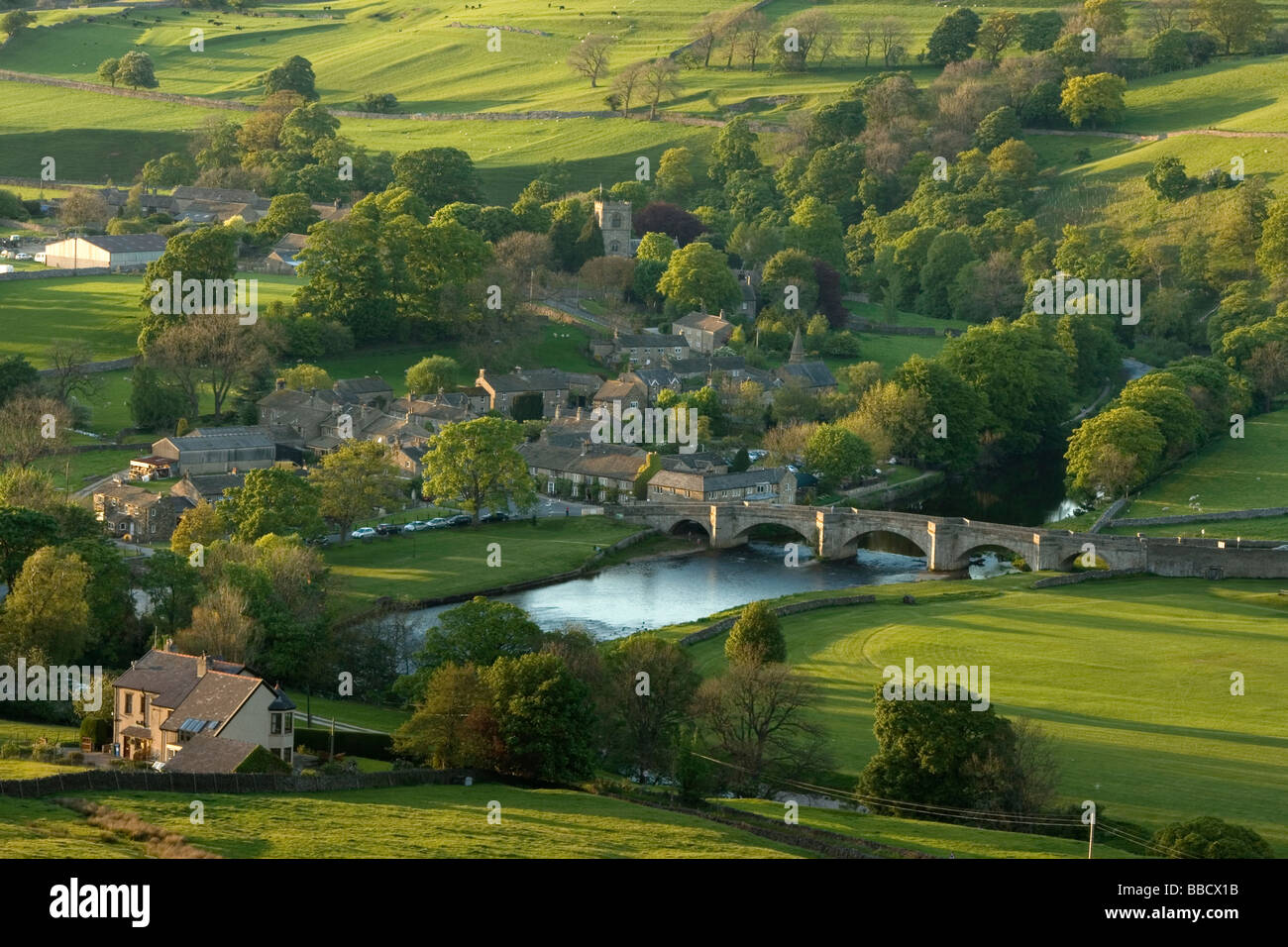 A view of the bridge and River Wharfe at the village of Burnsall, in Wharfedale, Yorkshire Dales, from the Burnsall Fells Stock Photo