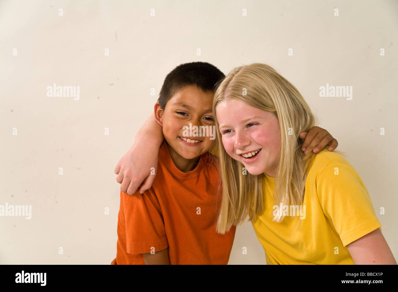 Having fun Multi ethnic racial Ethnically diverse Portrait of young Caucasian girl adopted Mexican Hispanic brother 7-11 year old olds United States Stock Photo