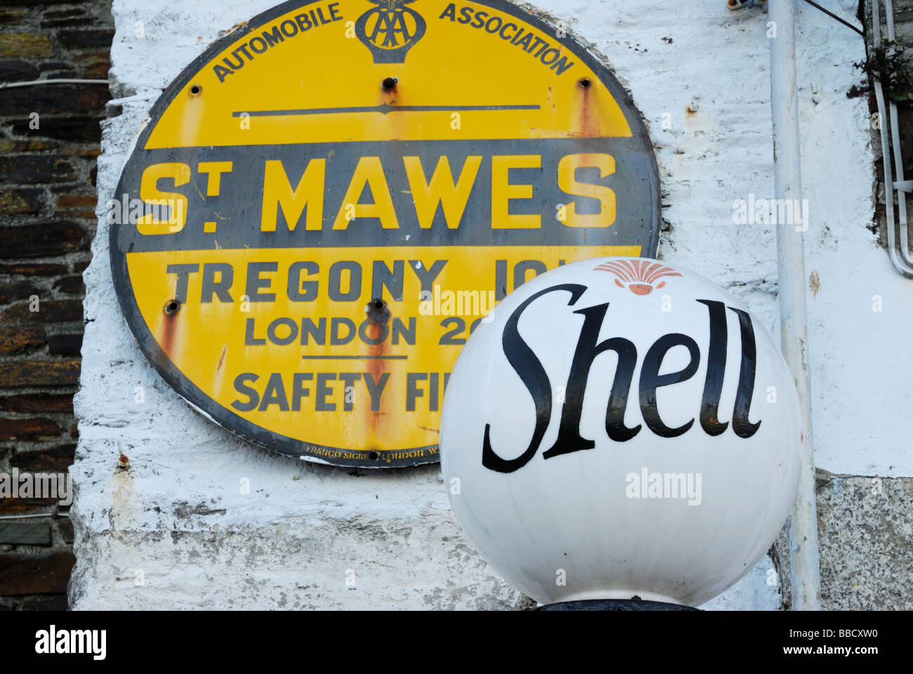 Old petrol pump and AA sign in St Mawes, Cornwall, UK Stock Photo