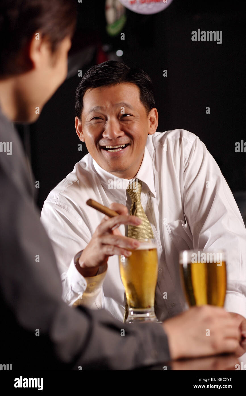 Two Men Drinking Beer Stock Photo Alamy