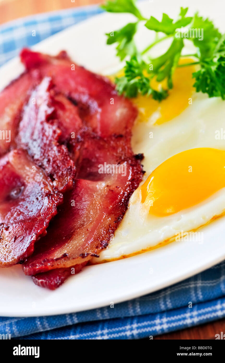 Tasty breakfast of bacon and fried eggs Stock Photo