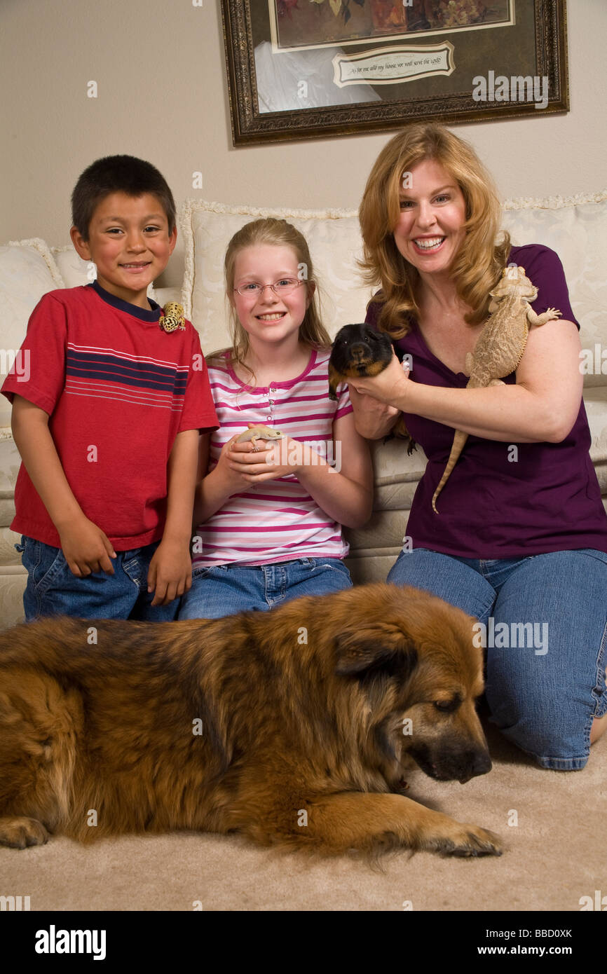 adoptionFamily with adopted foster child Mexican Hispanic boy adopts adoption adopting pets front MR  © Myrleen Pearson Stock Photo