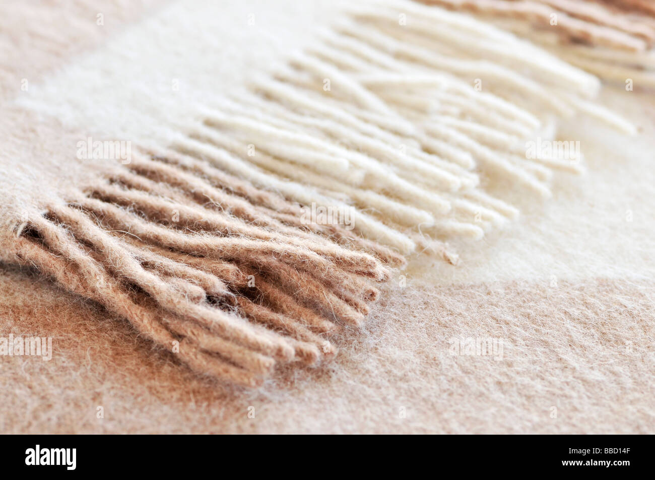 Soft and warm folded alpaca wool blanket with fringe Stock Photo Alamy
