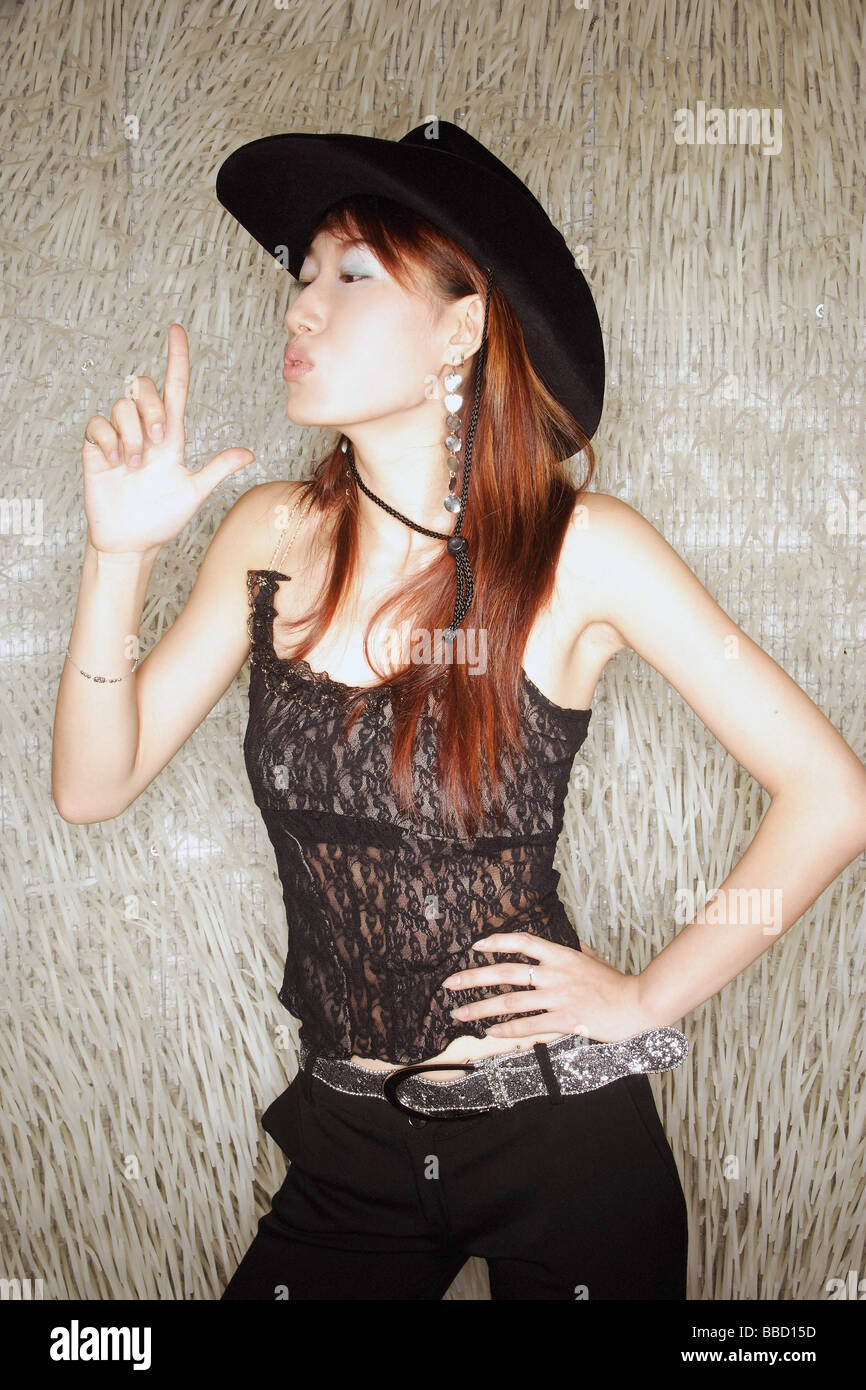 Asian woman wearing cowboy hat hi-res stock photography and images - Alamy
