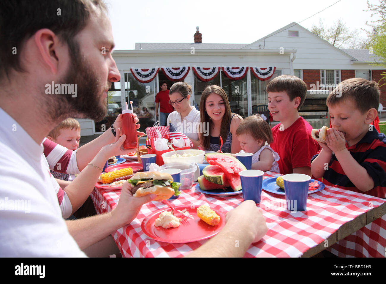 Large family gathering for a 4th of July barbecue Stock Photo