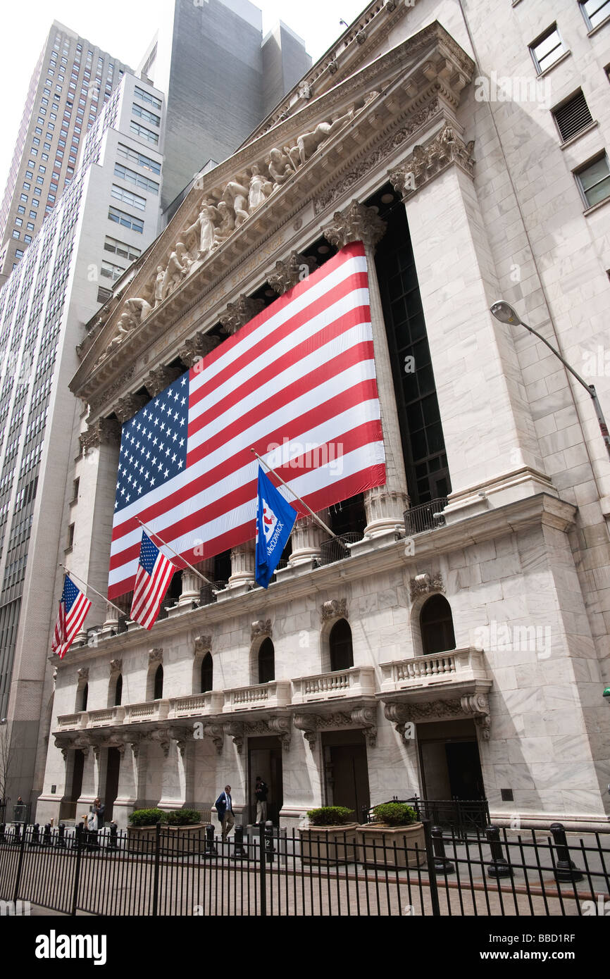 Flags waving outside the New York Stock Exchange building by Wall