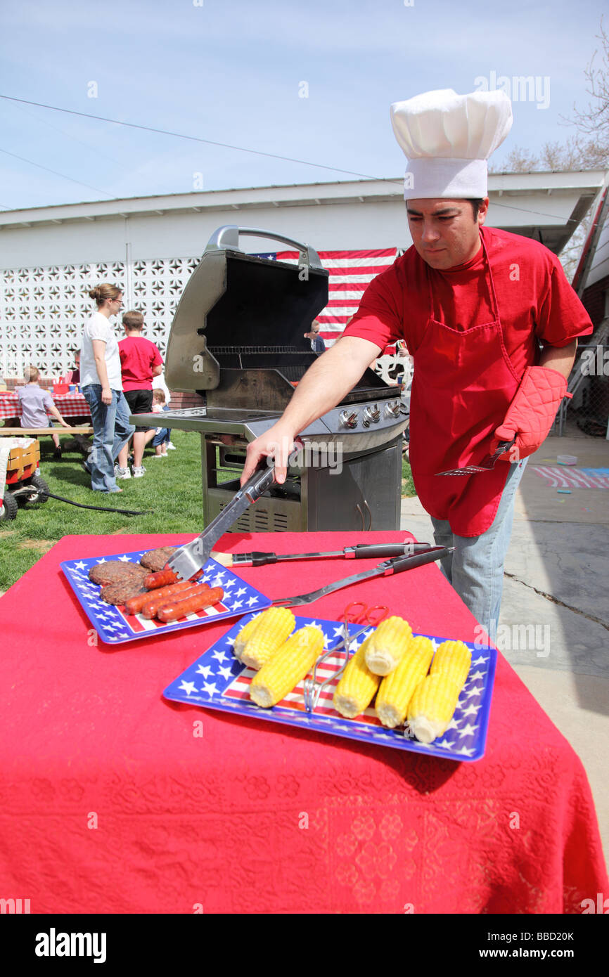 Man cooking at a 4th of July Barbecue Stock Photo