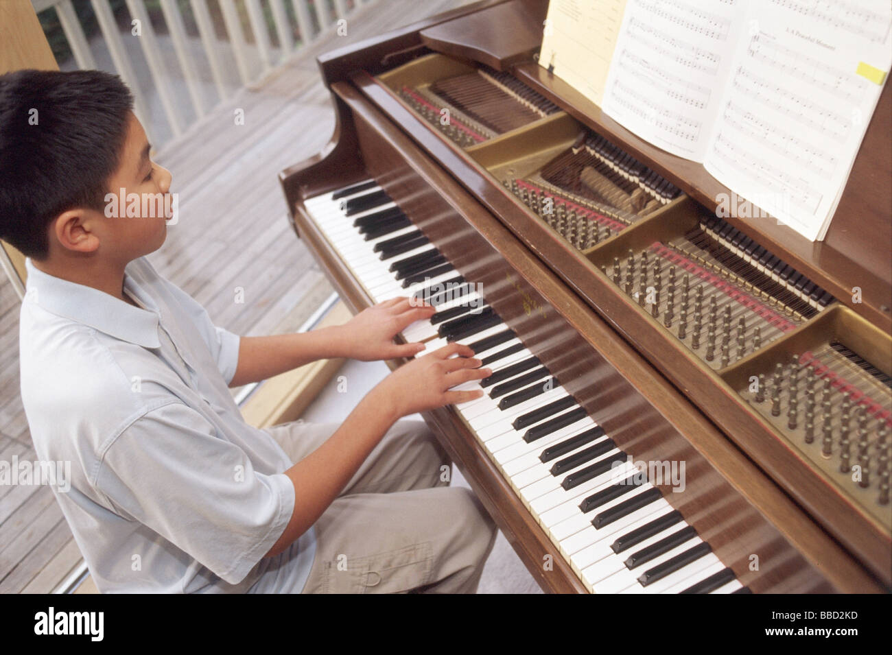 Boy Playing The Piano Stock Photo Alamy   Boy Playing The Piano BBD2KD 