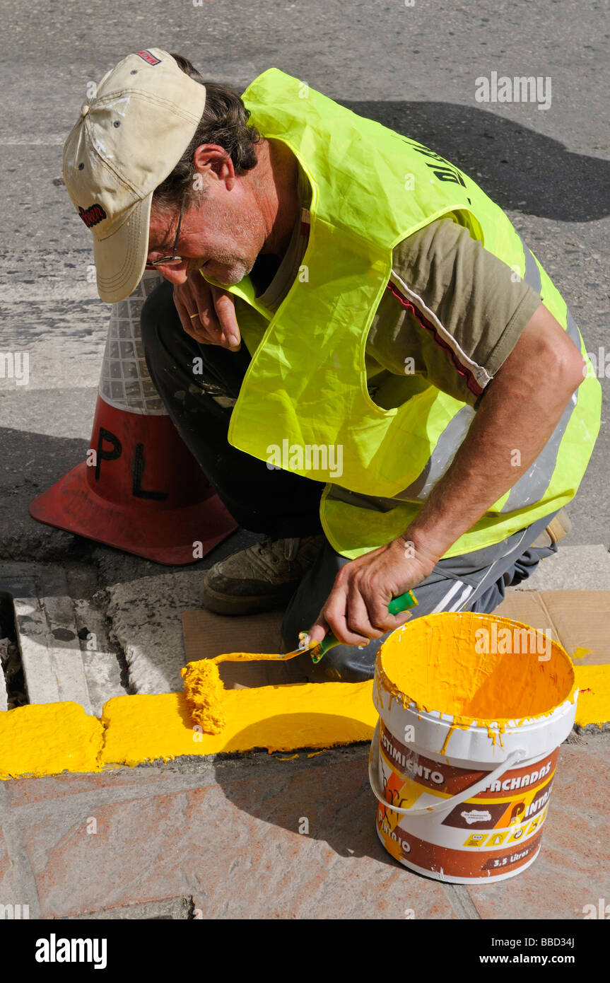 Hand painting curb yellow Stock Photo Alamy