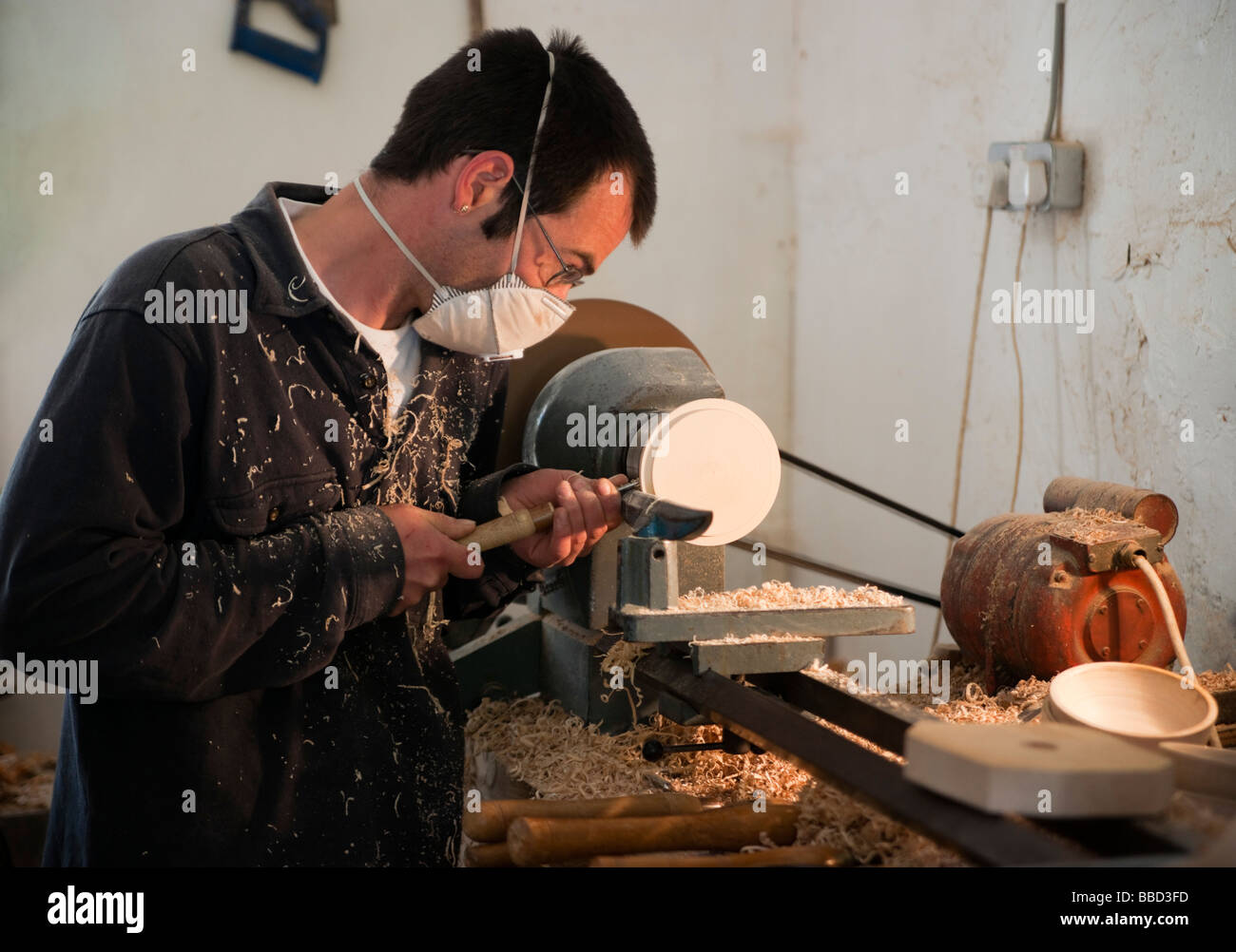 Traquair House Scotland treen woodturner in crafts wearing mask to avoid inhaling