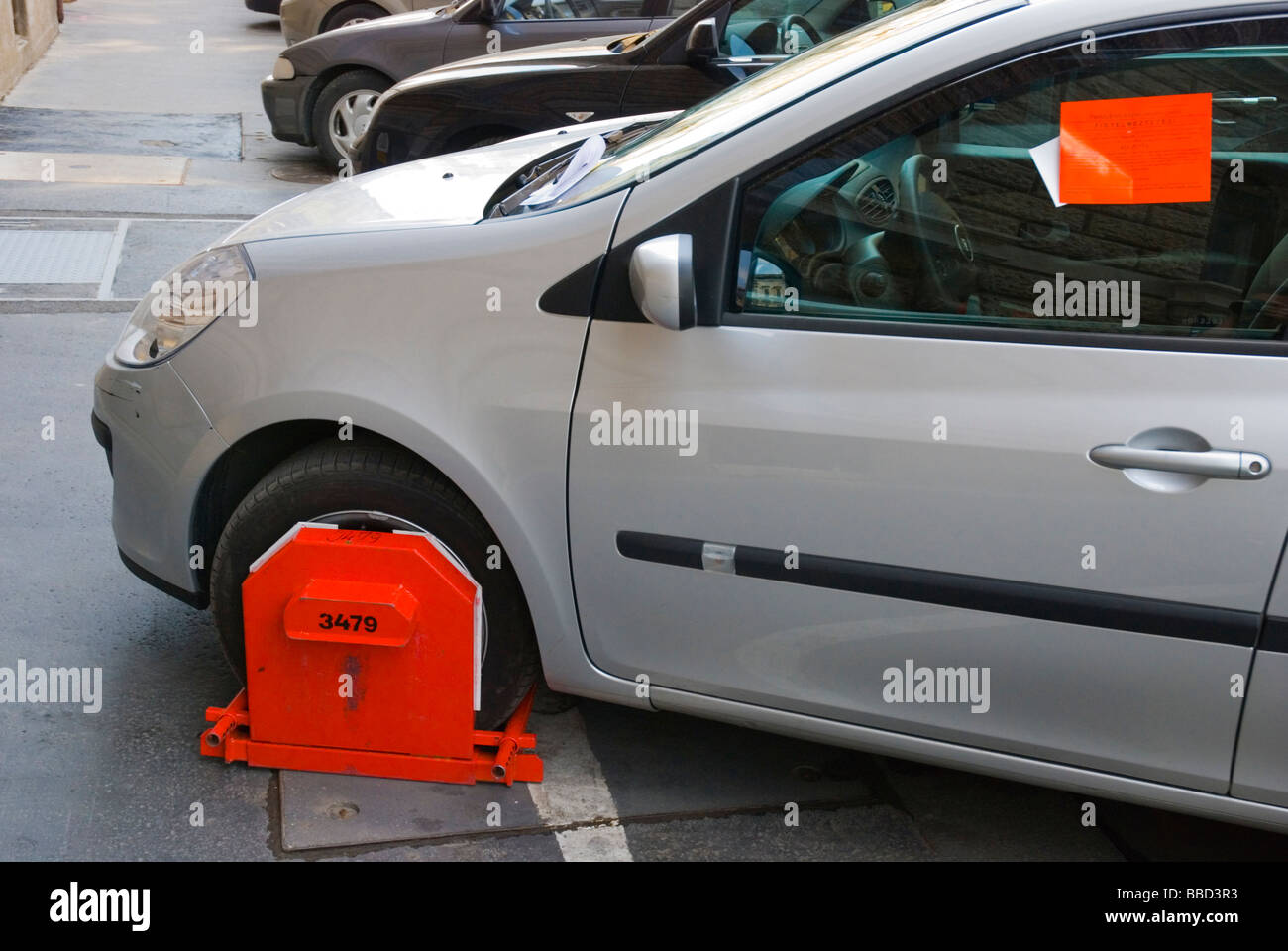 Car wheel clamped illegal parking hires stock photography and images