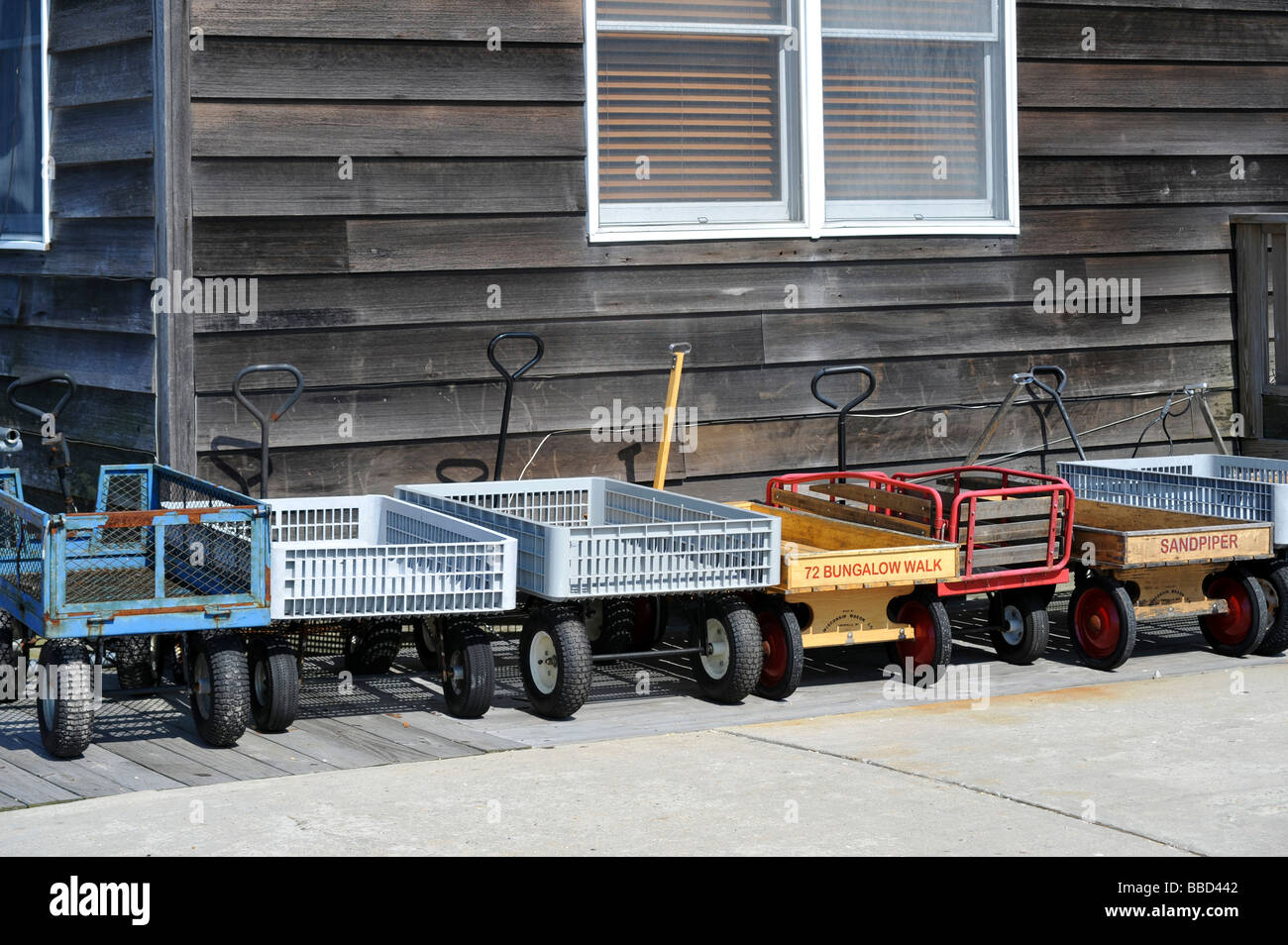 Resident s Utility Wagons parked at Car Free Ocean Beach Fire Island New York USA Stock Photo