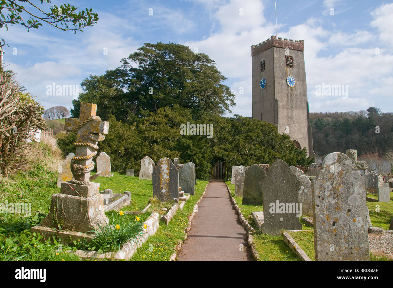 St Mary and St Gabriel Church graveyard and yew tree in Stoke Gabriel Britain Stock Photo