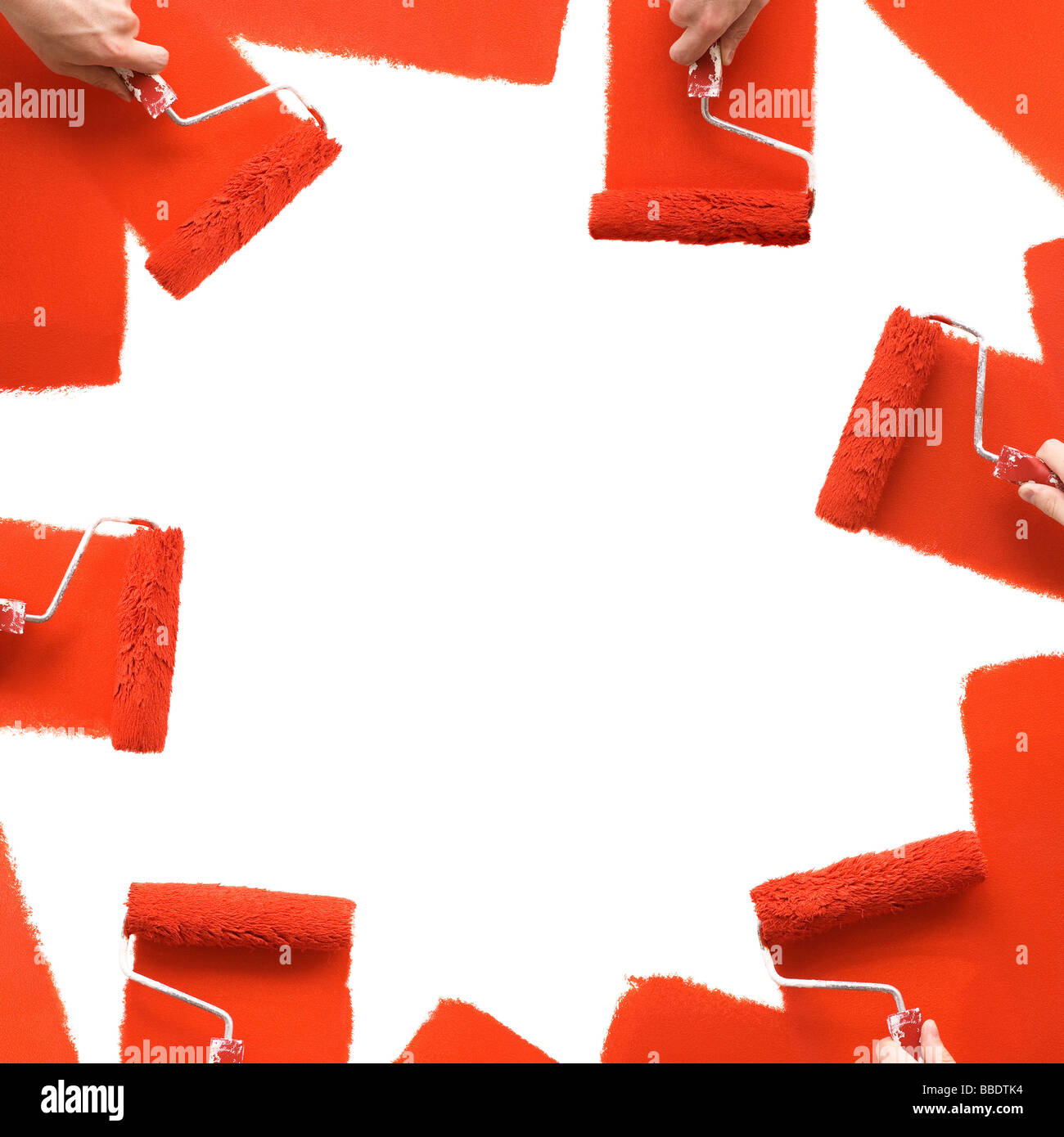 Painting white wall with red rollers Stock Photo Alamy