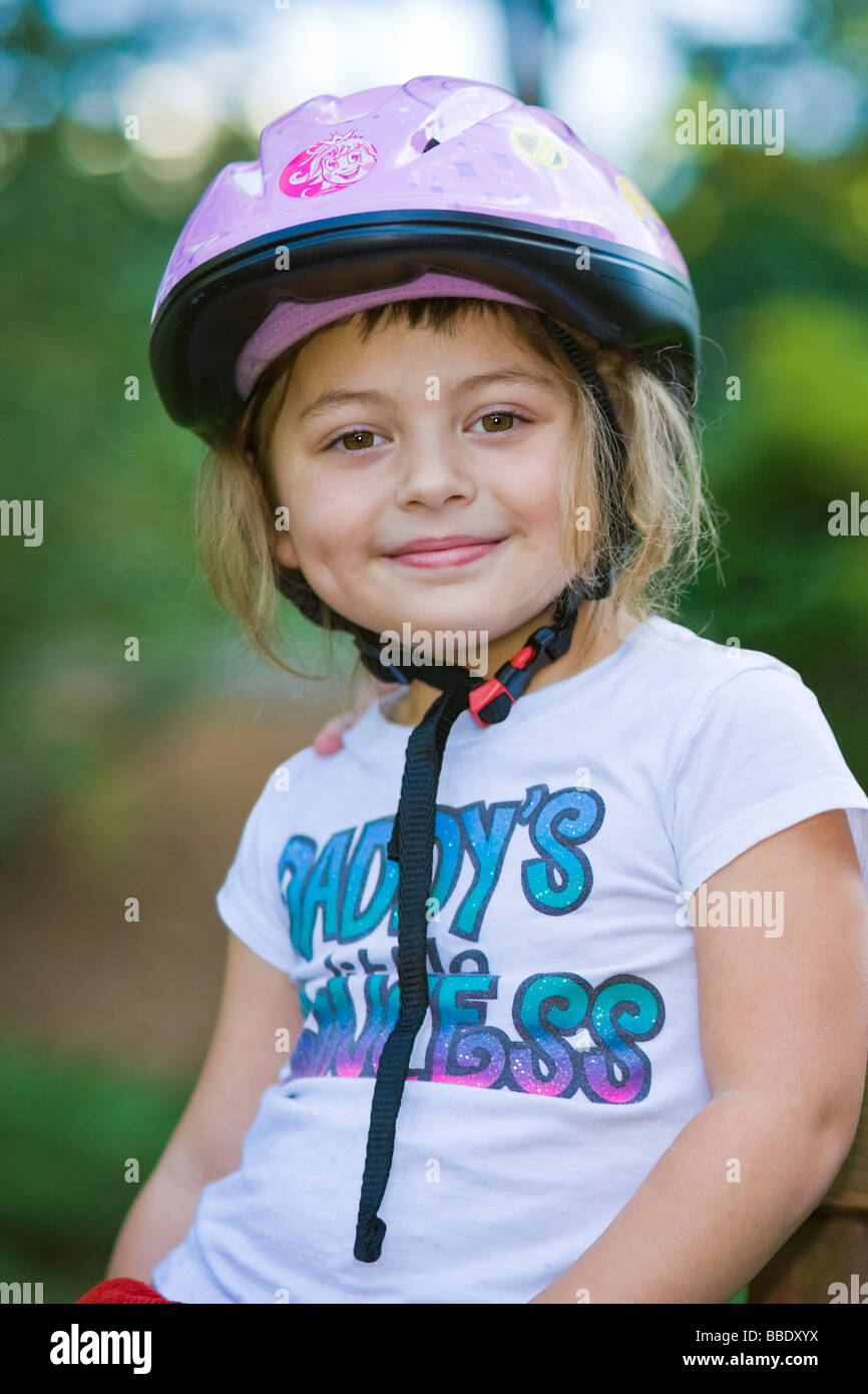 Close up portrait little girl wearing helmet hires stock photography