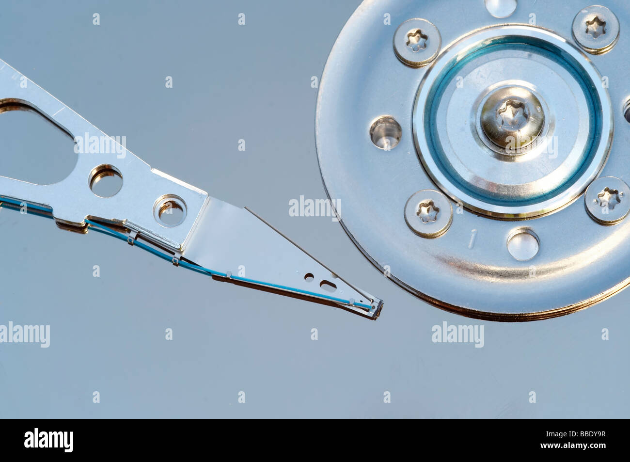 Detail of the hard disc and read head - hardware Stock Photo