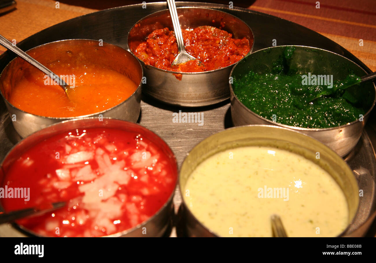 Dishes of chutney in Indian restaurant in Birmingham Stock Photo
