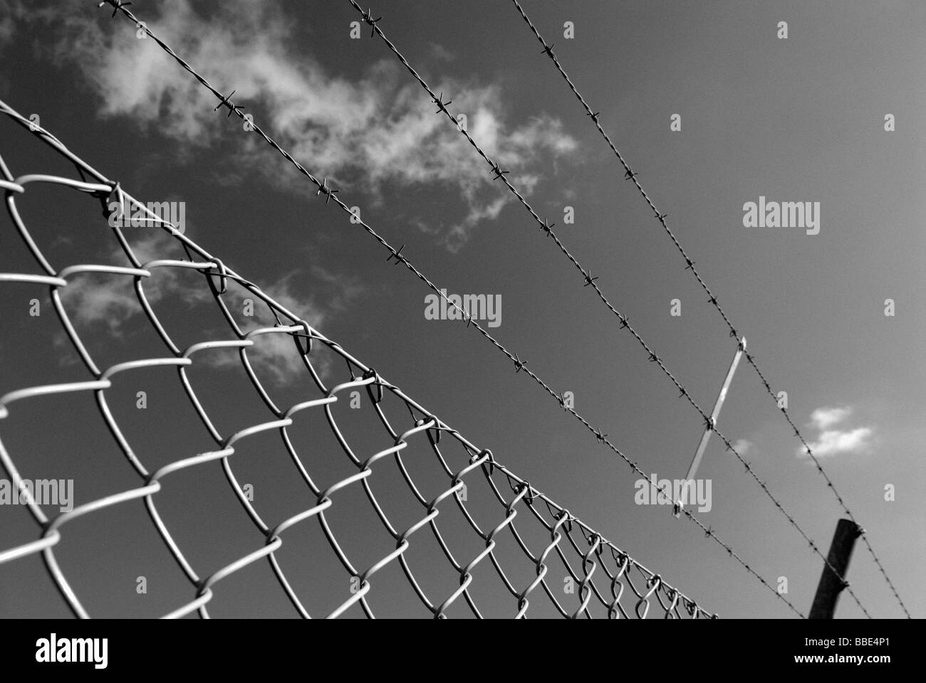 CHAINLINK FENCE WITH BARBED WIRE Stock Photo Alamy